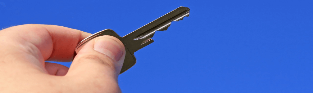 Hand holding key in air