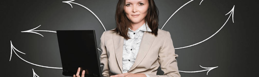 business woman holding computer